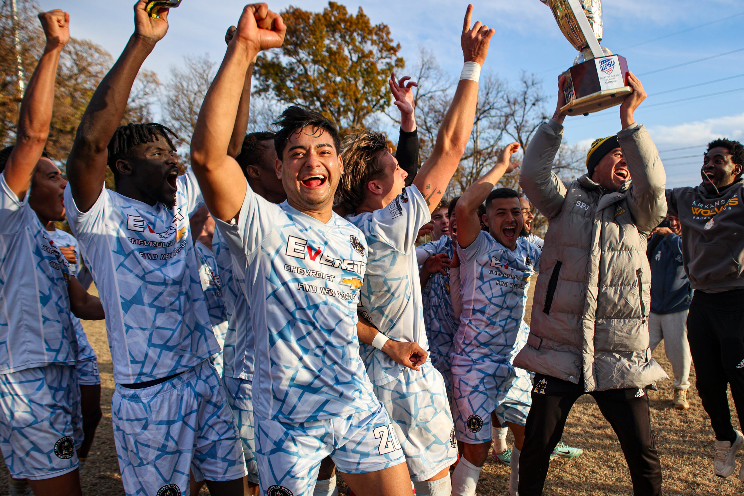 Arkansas Wolves II celebrating with a trophy