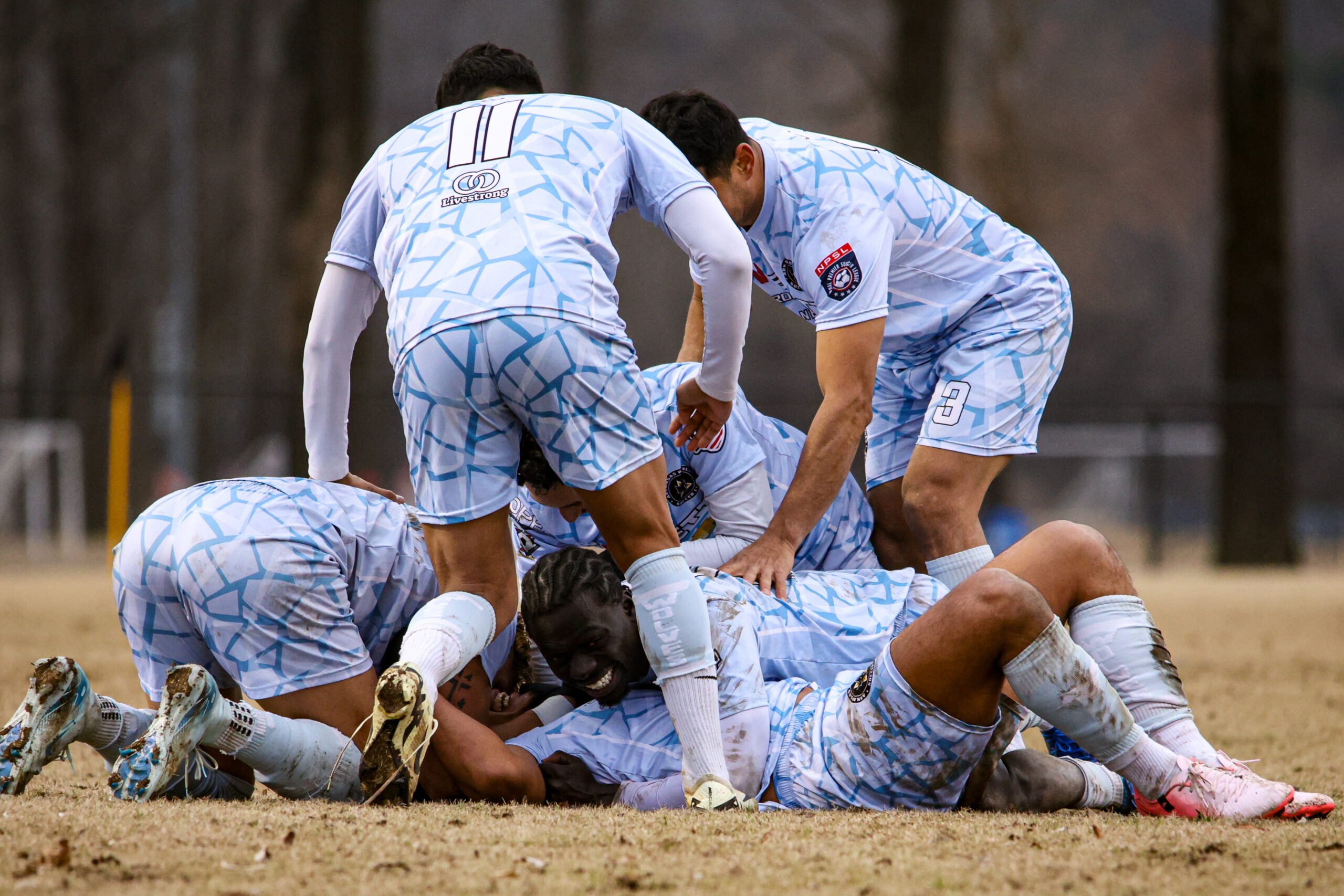 Arkansas Wolves players celebrating together